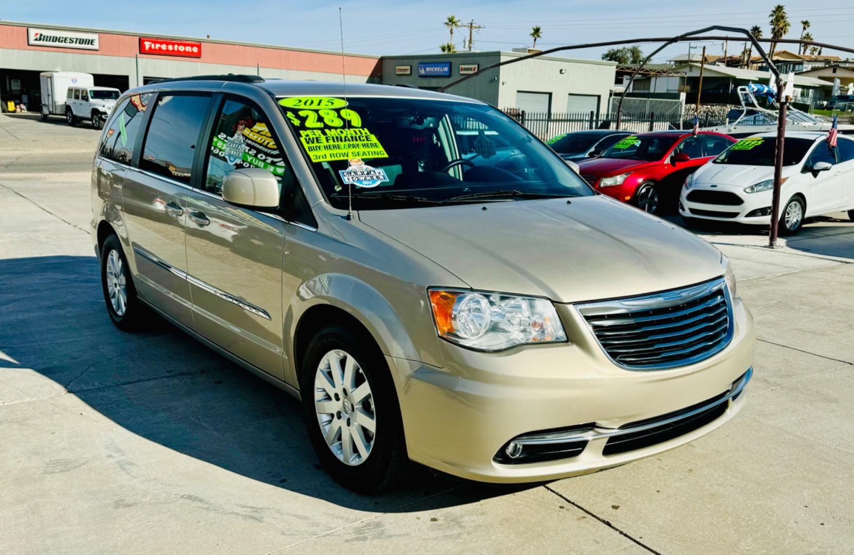 2015 gold Chrysler Town & Country (2C4RC1BG8FR) , located at 2190 Hwy 95, Bullhead City, AZ, 86442, (928) 704-0060, 0.000000, 0.000000 - 2015 Chrysler town and country . Loaded . Seats7 . Bluetooth , backup camera . Free warranty , we finance . drop down tv with dvd player. headphone sets. Michelin tires. v6 automatic . Top of the line van. Fully loaded. - Photo#0